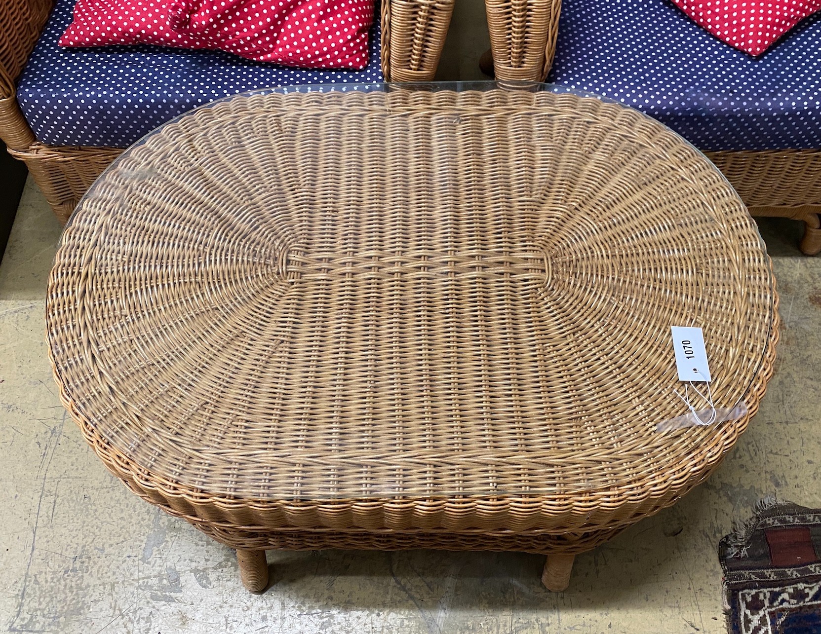 A pair of rattan conservatory chairs and a matching low table